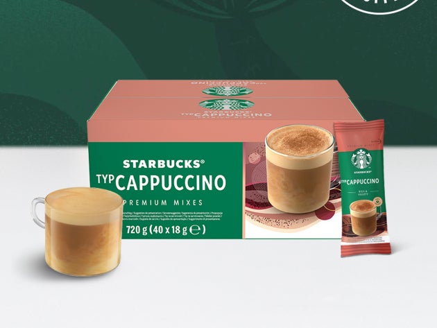Café instantané Starbucks® Cappuccino Premium dans une tasse en verre, présenté avec un sachet et son emballage